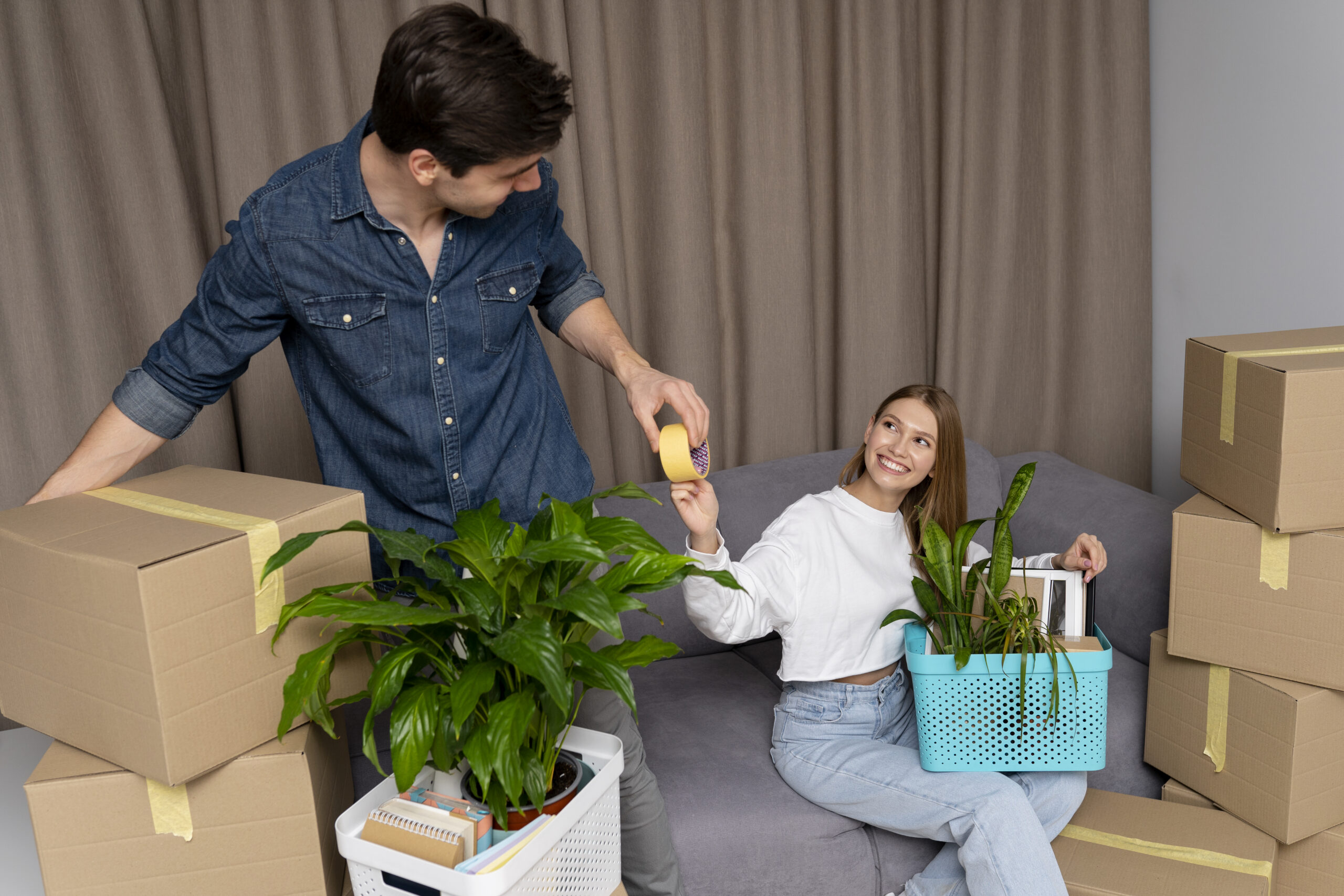 Couple packing boxes for moving day
